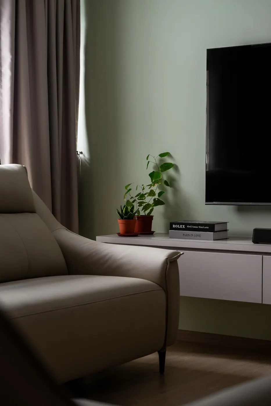 Sage feature wall with floating TV console, 290C Compassvale