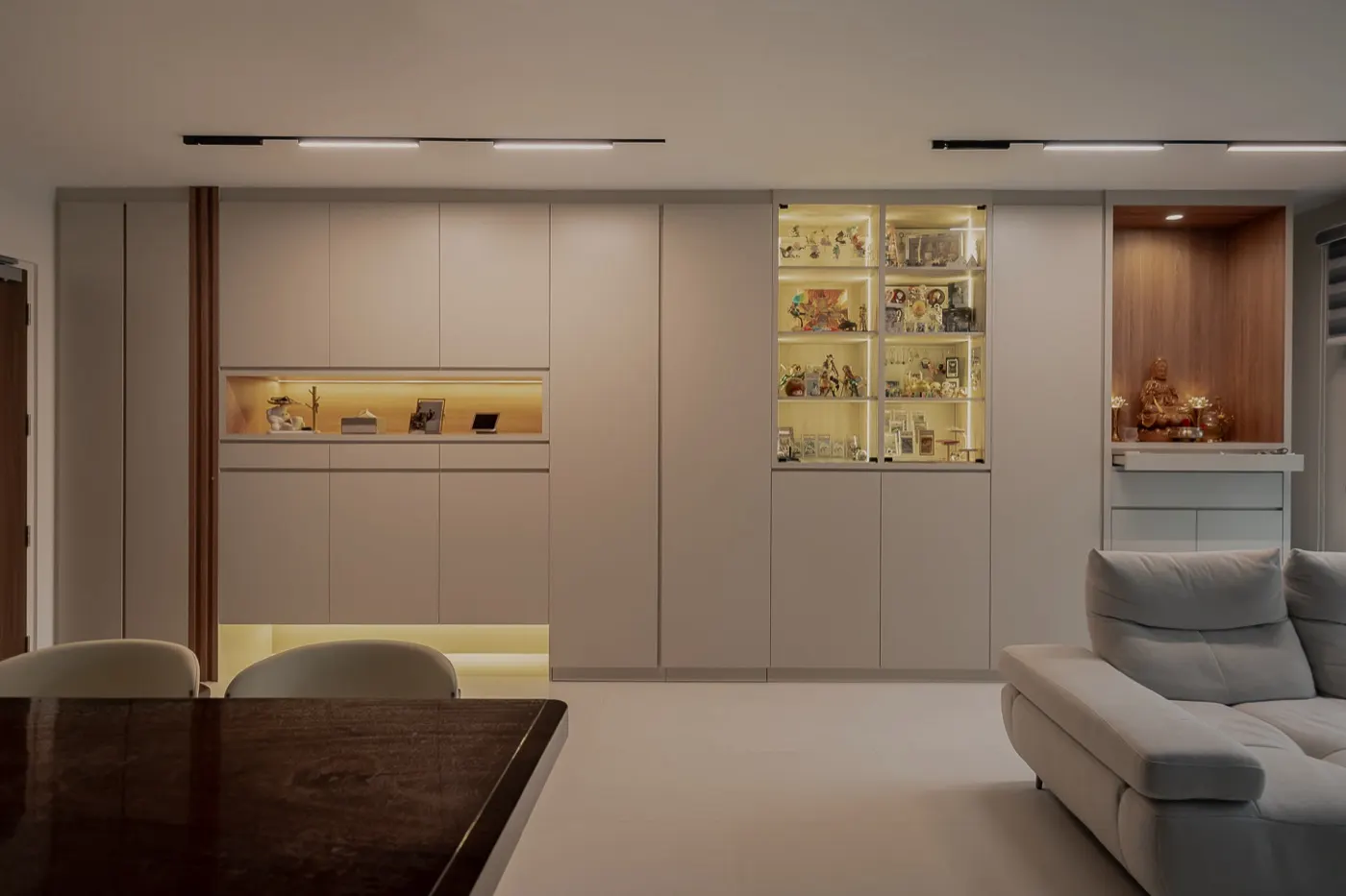 Full-height storage wall with lit display niches, 325A Tengah Garden Walk