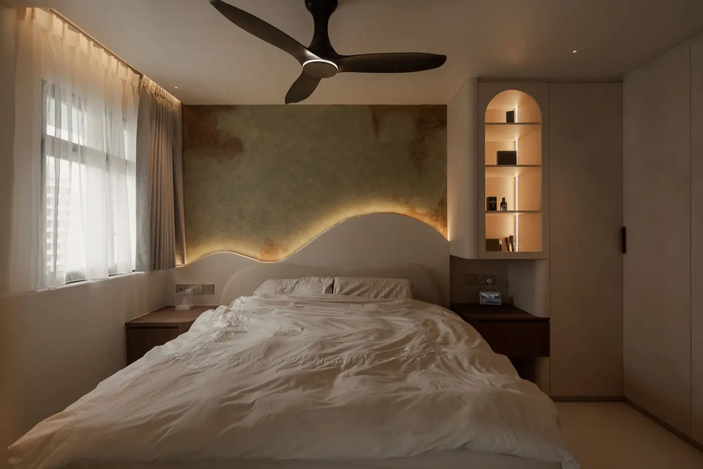 Master bedroom with lit curved headboard and arched niches, 307B Tengah Drive