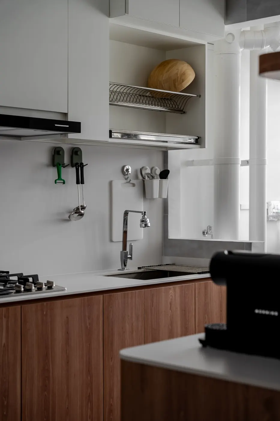 Kitchen with walnut lower cabinets and open shelf, Tengah Drive